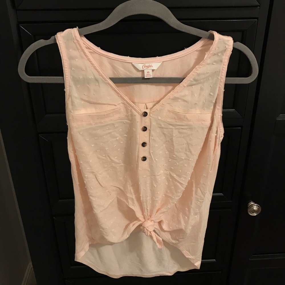 sleeveless pink blouse